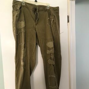 Olive colored distressed jeans